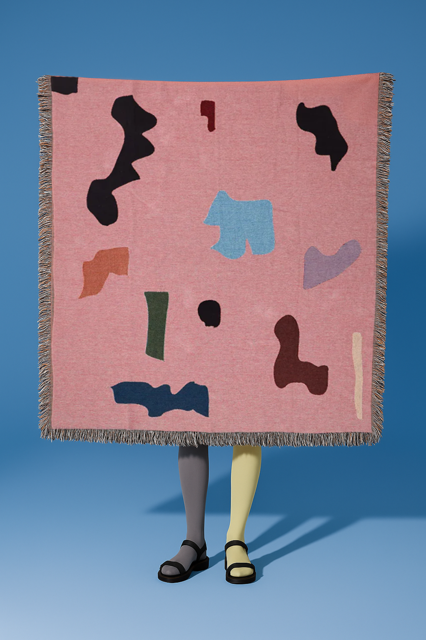 Gewebte Überwurfdecke mit abstrakter Form 