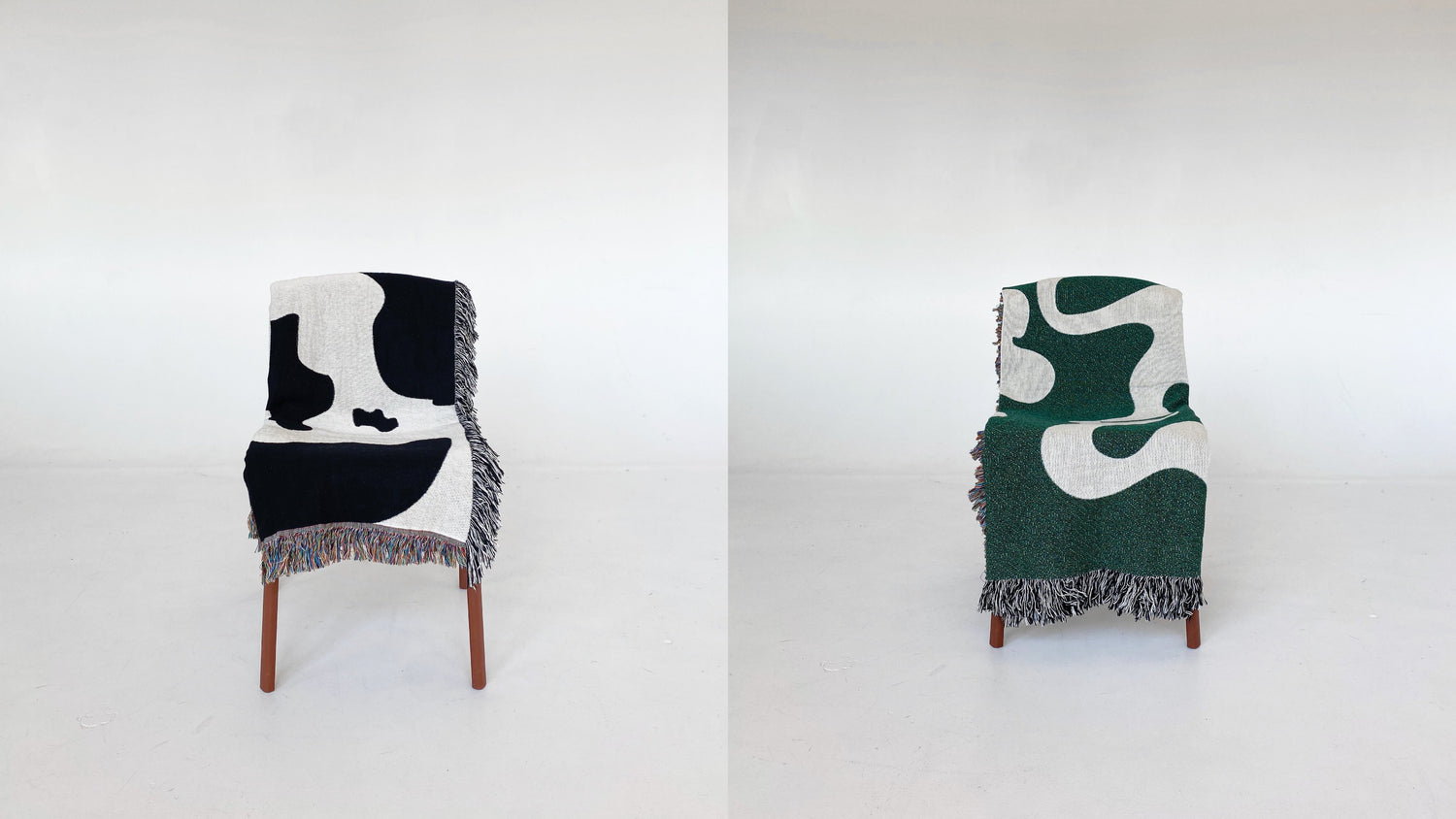 'Cowgirl' and 'Dancing Shapes - Forest Green' woven blankets placed on chairs
