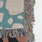 Wild thing woven throw blanket with reverse side and fringe